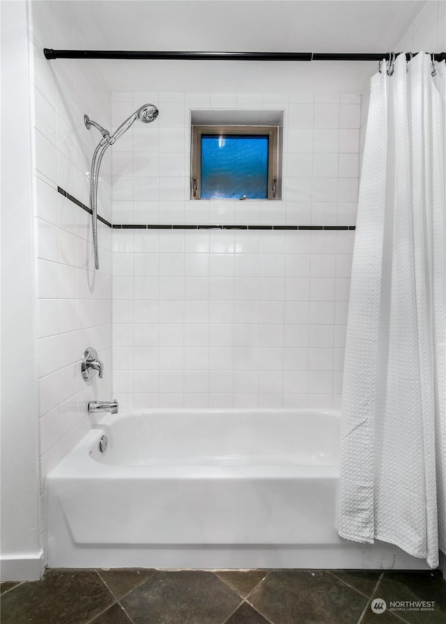 bathroom featuring tile patterned flooring and shower / bath combo