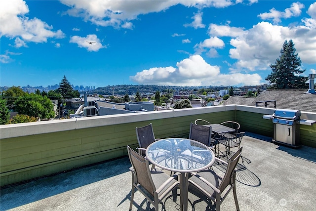 view of patio / terrace with a balcony and area for grilling