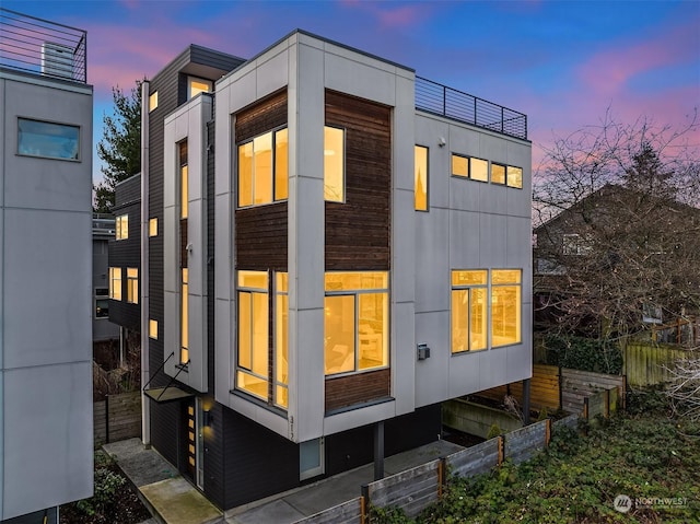 view of property exterior at dusk