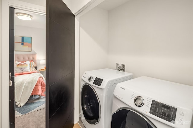 laundry area with separate washer and dryer