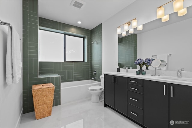 full bathroom with vanity, tiled shower / bath combo, and toilet