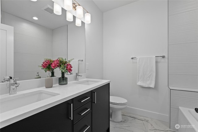 bathroom with vanity and toilet