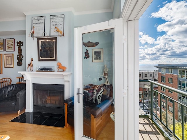 interior space with hardwood / wood-style floors and crown molding