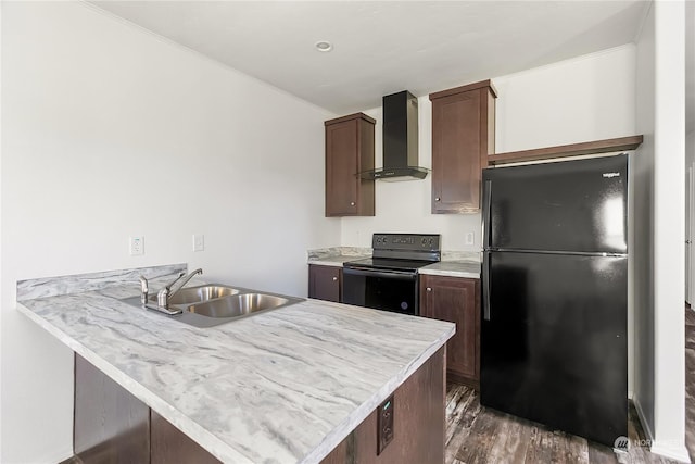 kitchen with wall chimney range hood, sink, dark hardwood / wood-style floors, black appliances, and kitchen peninsula