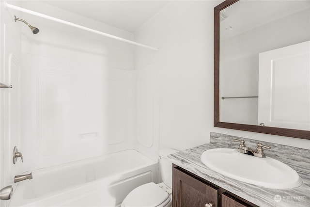 full bathroom featuring vanity,  shower combination, and toilet