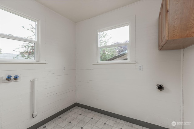 laundry area featuring cabinets