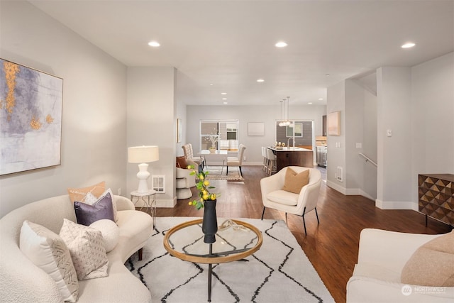 living room featuring dark hardwood / wood-style floors