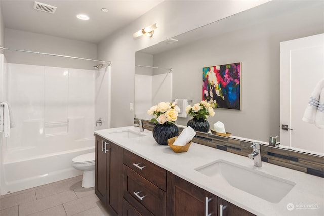 full bathroom with vanity,  shower combination, tile patterned floors, and toilet