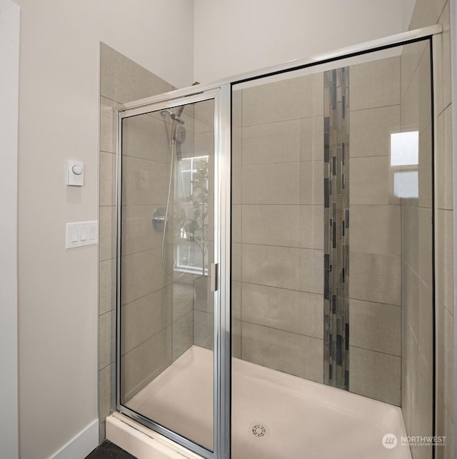 bathroom featuring an enclosed shower