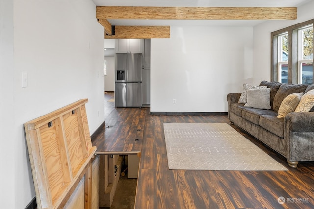 living room with beamed ceiling and dark hardwood / wood-style flooring