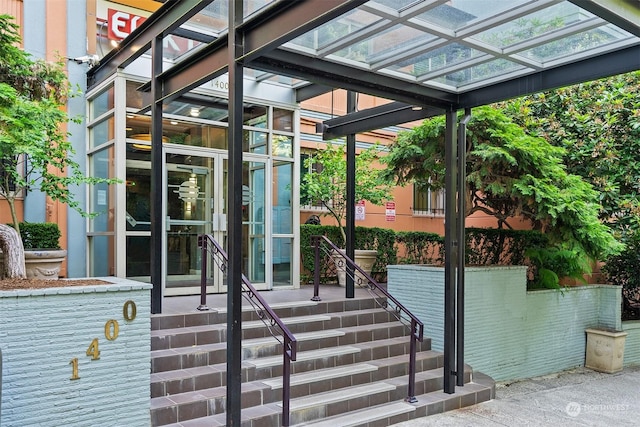 doorway to property featuring a pergola