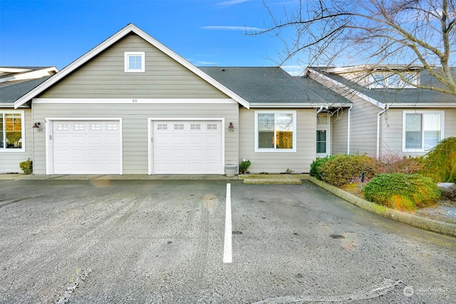 ranch-style home with a garage