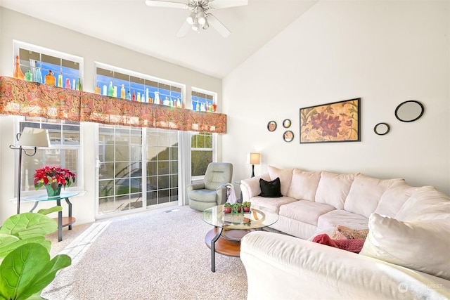 living room featuring ceiling fan, high vaulted ceiling, and carpet floors