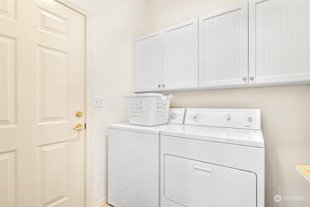 laundry area with cabinets and washer and dryer