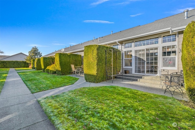 exterior space with a yard and a patio area