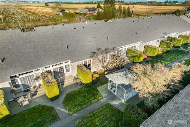 birds eye view of property featuring a rural view