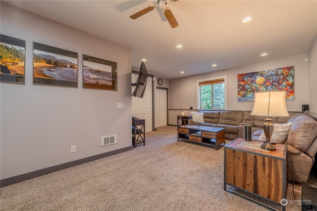 living area featuring recessed lighting, carpet flooring, a ceiling fan, baseboards, and visible vents