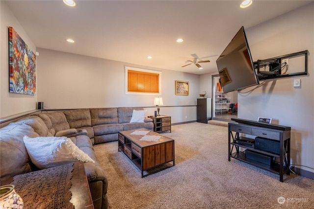 carpeted living area with ceiling fan, baseboards, and recessed lighting