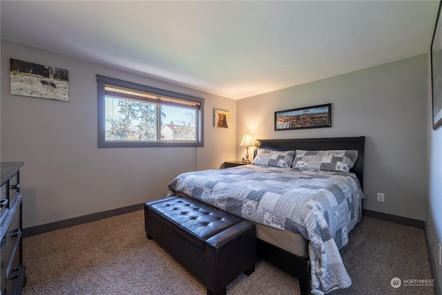 carpeted bedroom featuring baseboards