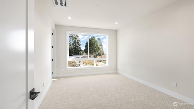 unfurnished room with light colored carpet