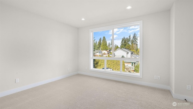 carpeted empty room featuring a healthy amount of sunlight