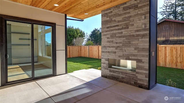 view of patio / terrace with an outdoor stone fireplace