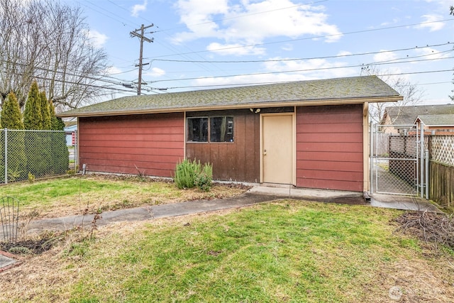 view of outdoor structure with an outbuilding and fence