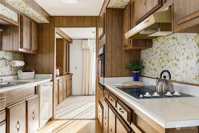 kitchen with sink and black appliances