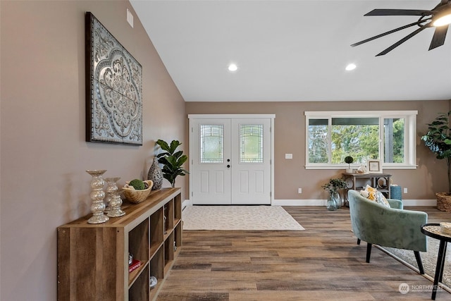 entrance foyer with vaulted ceiling, dark hardwood / wood-style floors, and ceiling fan