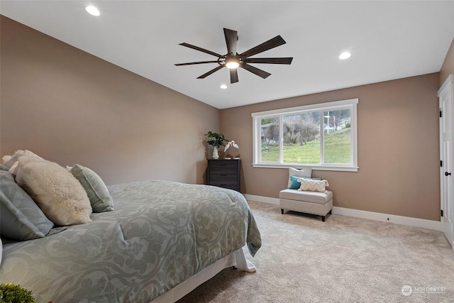 carpeted bedroom featuring lofted ceiling and ceiling fan