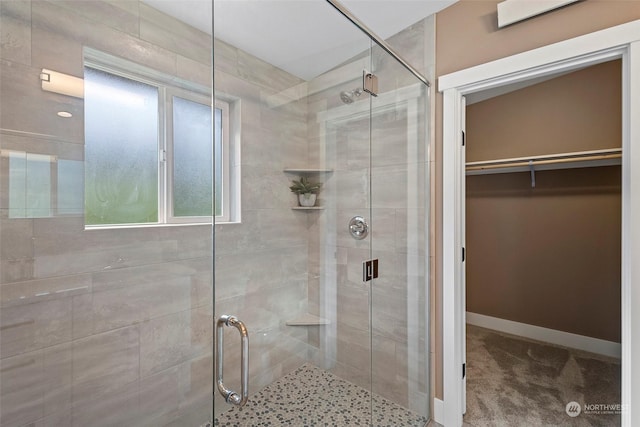 bathroom with a shower with shower door