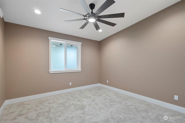 carpeted empty room with ceiling fan