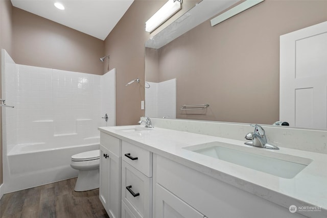 full bathroom with vanity, toilet, tub / shower combination, and hardwood / wood-style floors