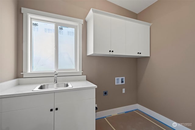 laundry room with cabinets, washer hookup, hookup for an electric dryer, and sink