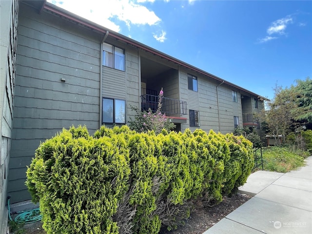 view of home's exterior featuring a balcony