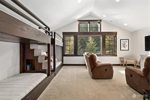 carpeted bedroom with multiple windows and lofted ceiling