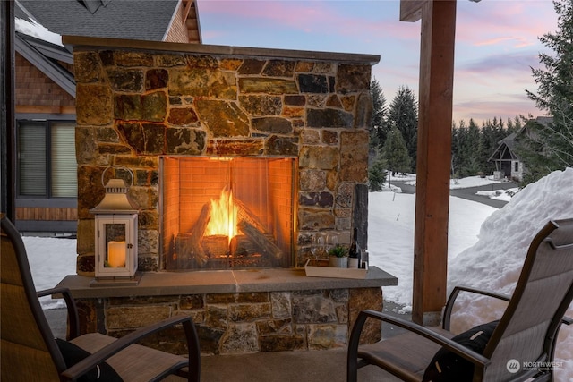 exterior details with an outdoor stone fireplace