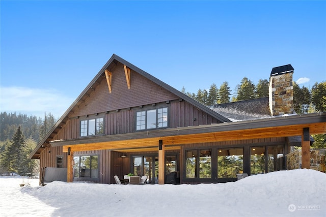 view of snow covered house