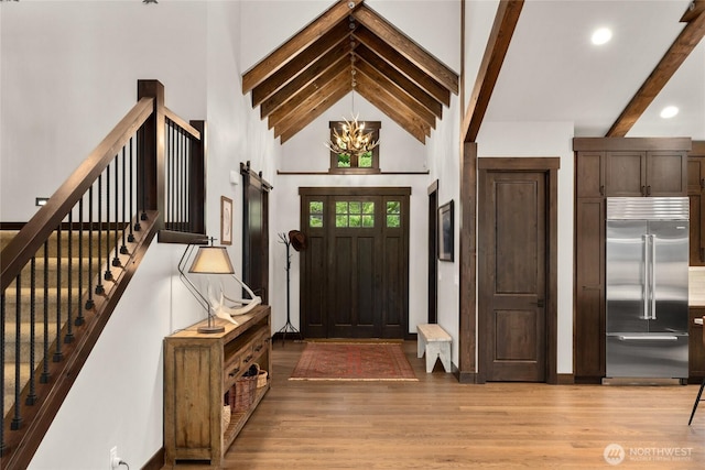 120 Rocky Run Loop, Cle Elum, WA 98922 - foyer with beamed ceiling, light wood-type flooring, high vaulted ceiling, a chandelier, and stairway