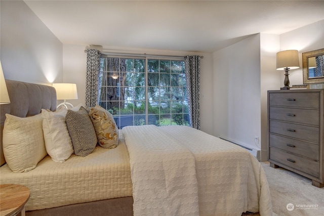 carpeted bedroom with baseboard heating