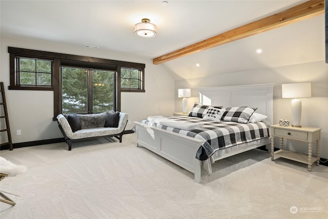 carpeted bedroom featuring vaulted ceiling with beams