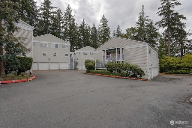 view of front of property with a garage and covered porch