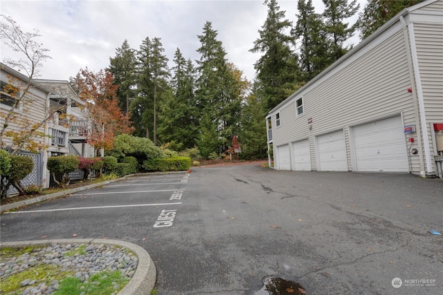 view of parking featuring a garage