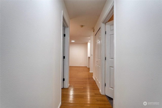 corridor featuring light hardwood / wood-style floors