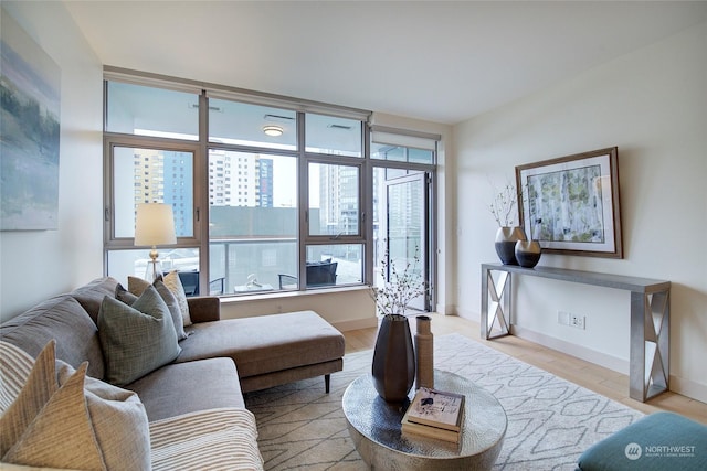 living room with light hardwood / wood-style flooring and a wealth of natural light