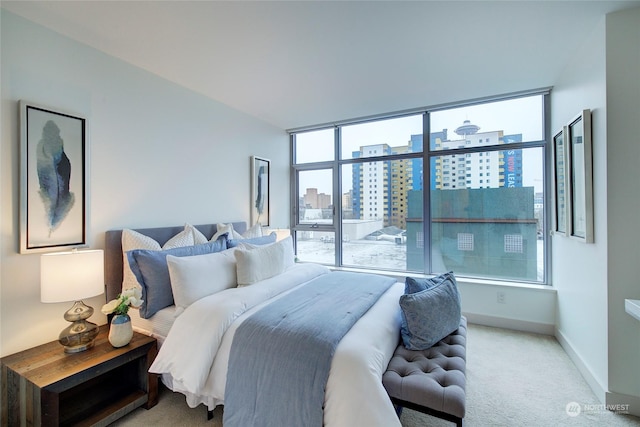 bedroom featuring light carpet