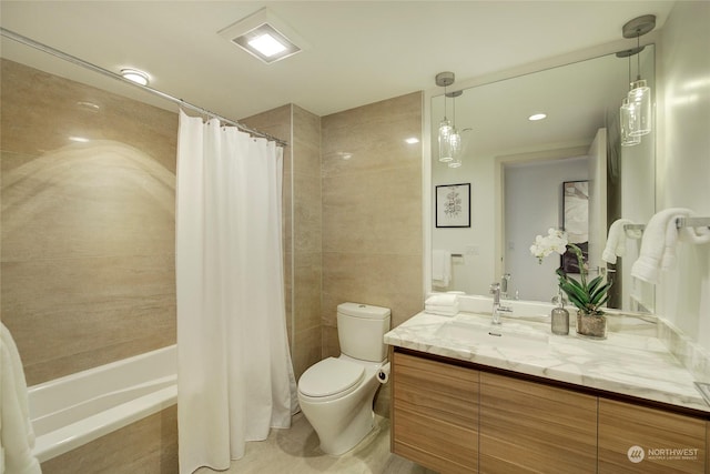 full bathroom featuring vanity, toilet, and shower / tub combo