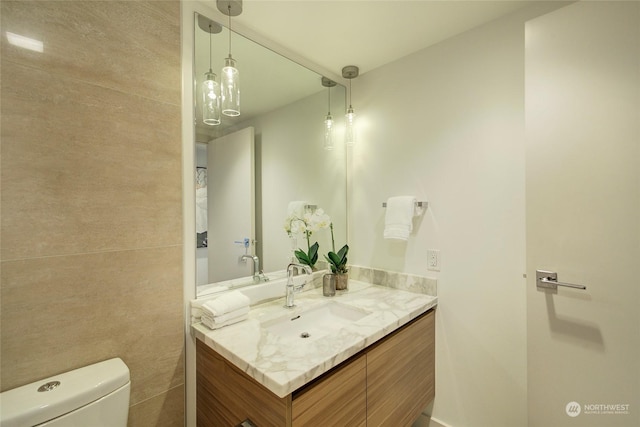 bathroom with vanity and toilet