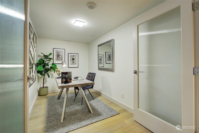 office with hardwood / wood-style floors