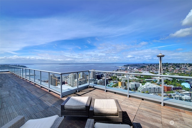 wooden deck featuring a water view